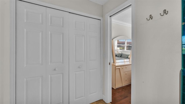 interior space with dark wood-style flooring and crown molding