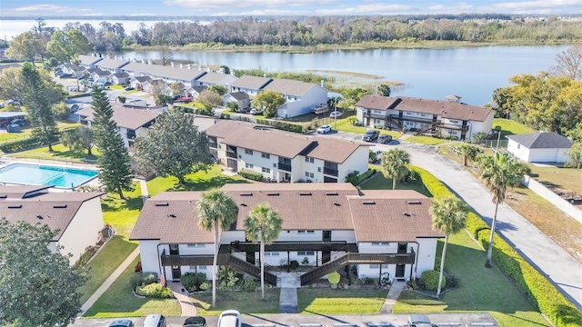 bird's eye view featuring a residential view and a water view