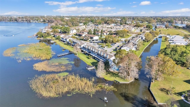 drone / aerial view featuring a water view and a residential view