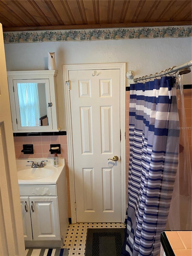 bathroom featuring tile walls, wood ceiling, vanity, and a shower with curtain