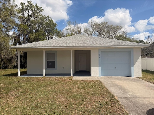 ranch-style house featuring an attached garage, driveway, roof with shingles, stucco siding, and a front yard