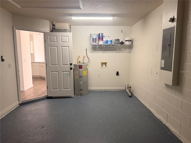 washroom featuring laundry area, concrete block wall, electric water heater, and electric panel