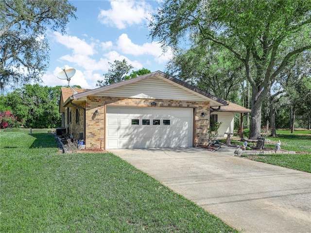 view of front of property with driveway, an attached garage, a front lawn, and brick siding