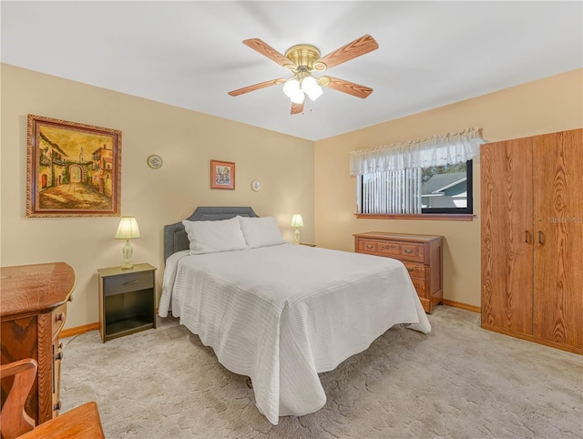 bedroom featuring carpet floors, baseboards, and a ceiling fan