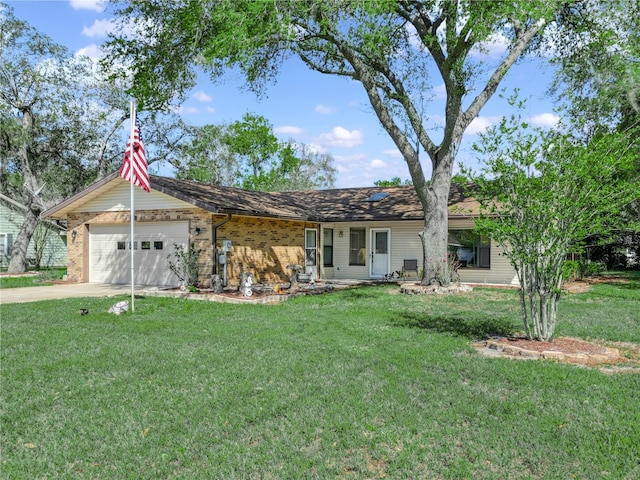 single story home with a front lawn, concrete driveway, brick siding, and an attached garage