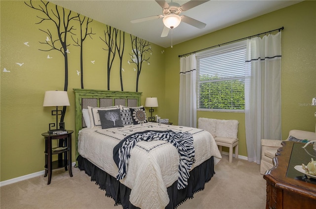 bedroom with baseboards, ceiling fan, and carpet flooring