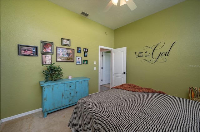 bedroom featuring visible vents, light carpet, baseboards, and a ceiling fan