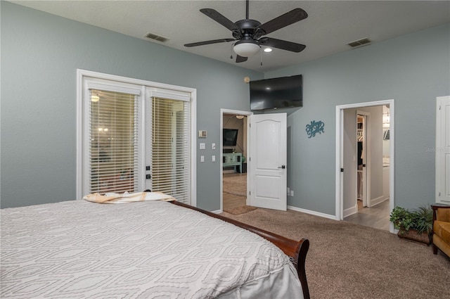 carpeted bedroom featuring access to outside, baseboards, visible vents, and ceiling fan