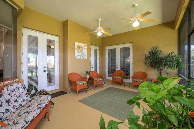 sunroom / solarium featuring french doors