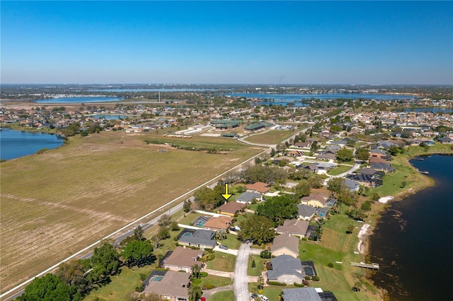 birds eye view of property with a residential view and a water view