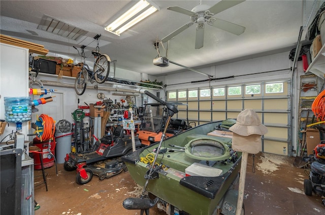 garage featuring a garage door opener and a ceiling fan