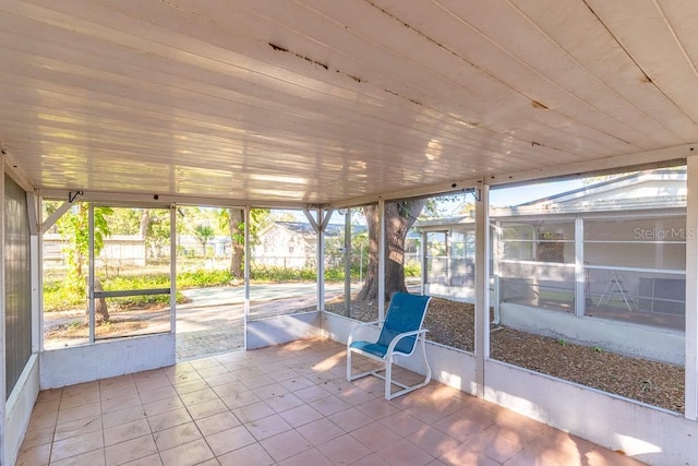 unfurnished sunroom featuring a healthy amount of sunlight