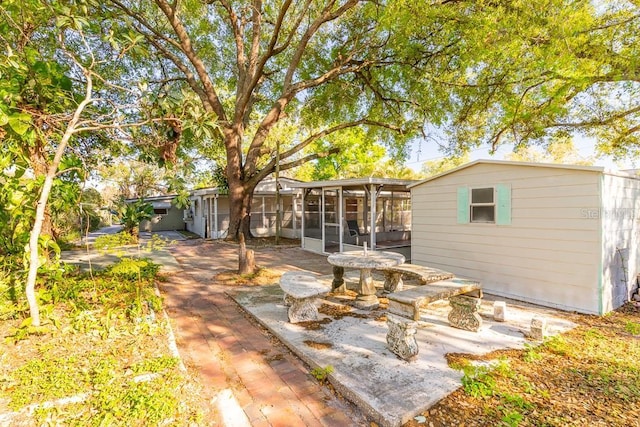 back of property featuring a sunroom