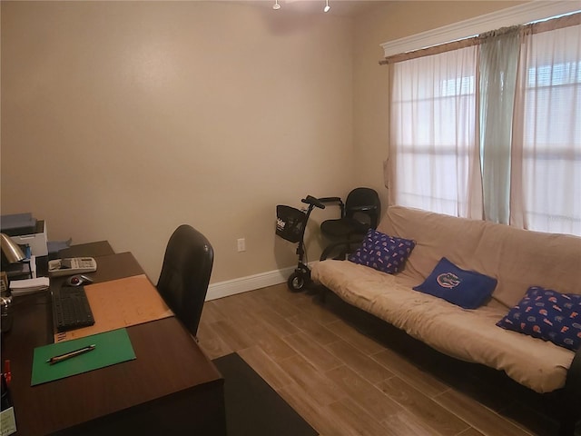 office with wood finished floors and baseboards