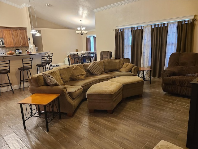 living room with visible vents, wood tiled floor, a chandelier, ornamental molding, and high vaulted ceiling