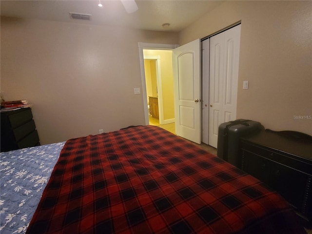 bedroom featuring visible vents, a closet, and ceiling fan