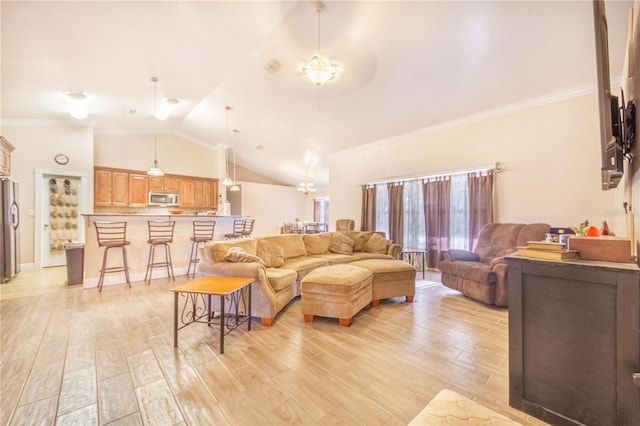 living area featuring crown molding, lofted ceiling, and light wood-type flooring