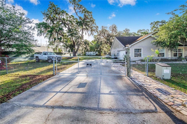 view of road featuring a gate and a gated entry