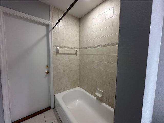 full bathroom featuring washtub / shower combination and tile patterned flooring