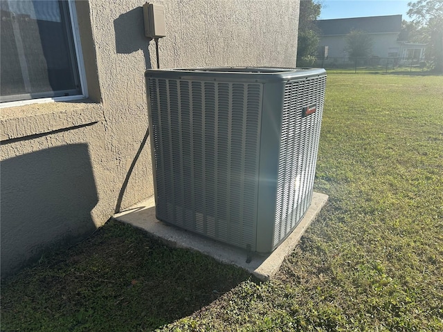 exterior details featuring central air condition unit and stucco siding