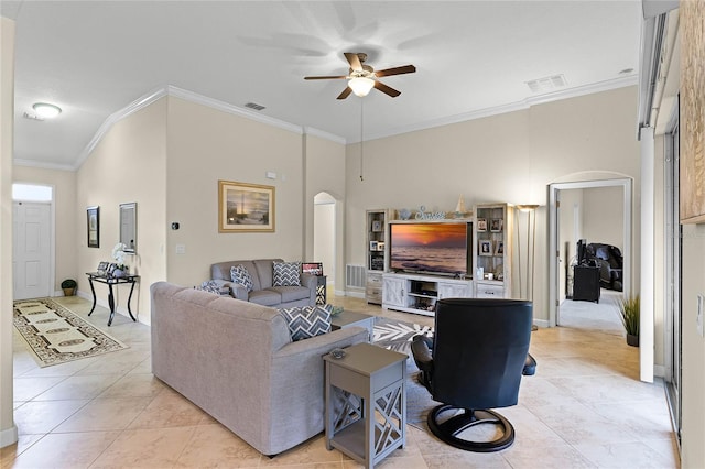 living room with visible vents, arched walkways, and crown molding