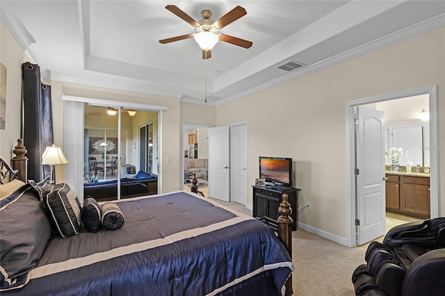 bedroom with baseboards, visible vents, a raised ceiling, and light carpet