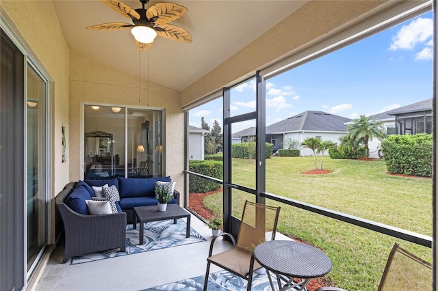 sunroom with vaulted ceiling and ceiling fan