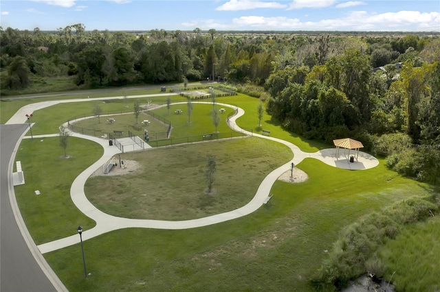 birds eye view of property featuring a view of trees