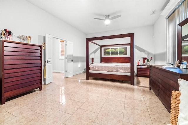bedroom featuring baseboards, visible vents, and a ceiling fan