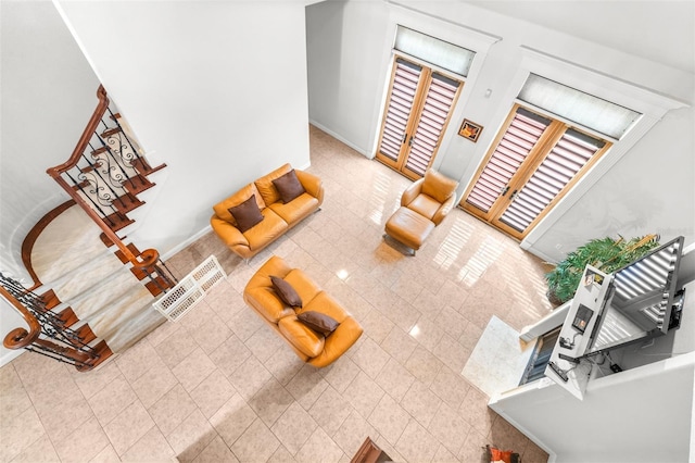 living area featuring stairway
