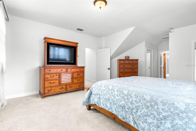 bedroom with light carpet, visible vents, and baseboards