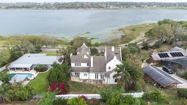 birds eye view of property with a water view