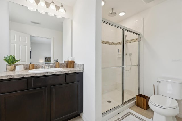 full bath with visible vents, toilet, a stall shower, vanity, and tile patterned flooring