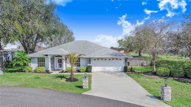 single story home with driveway, a garage, a shingled roof, fence, and a front lawn