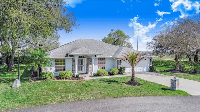 single story home featuring a front yard, driveway, an attached garage, and stucco siding