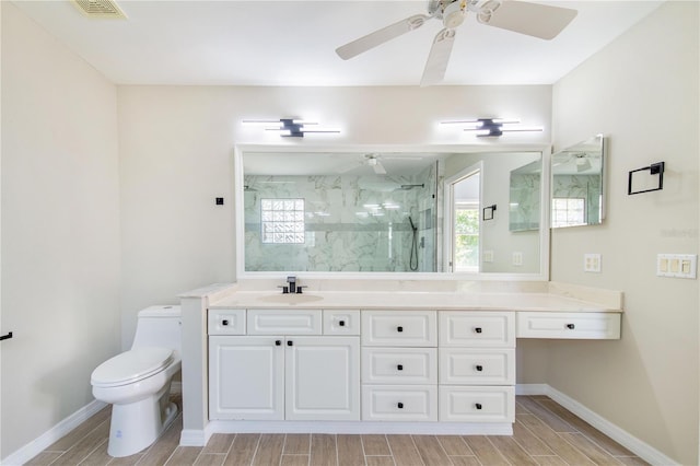 bathroom featuring wood tiled floor, visible vents, vanity, and a marble finish shower