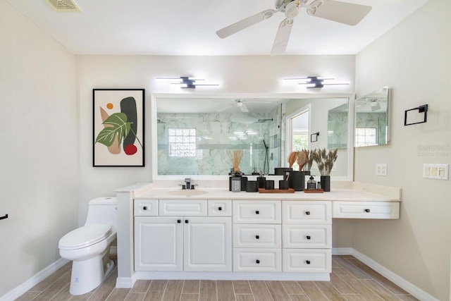 bathroom with toilet, wood finish floors, a sink, a marble finish shower, and double vanity