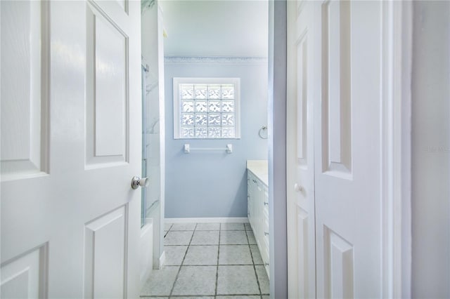 bathroom with  shower combination, tile patterned flooring, vanity, and baseboards