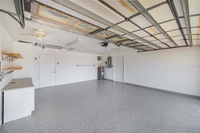 garage featuring ceiling fan, electric water heater, baseboards, electric panel, and a garage door opener