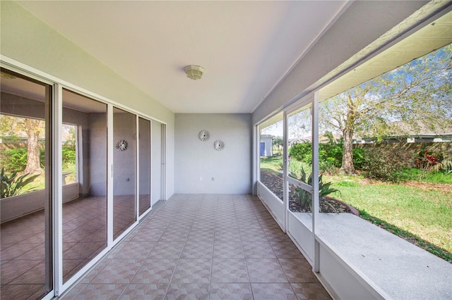 unfurnished sunroom with a wealth of natural light