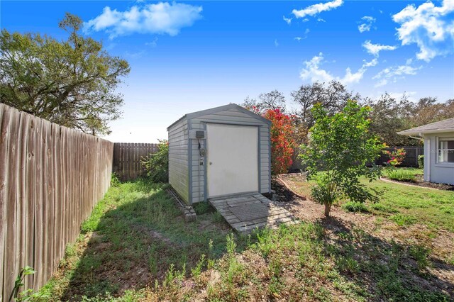 view of shed featuring a fenced backyard