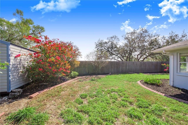 view of yard with a fenced backyard