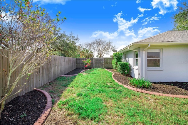 view of yard featuring a fenced backyard