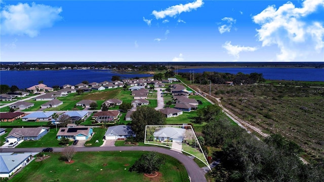 aerial view featuring a water view and a residential view