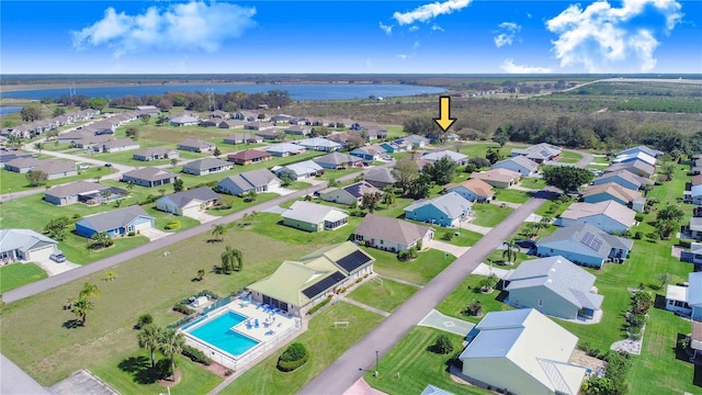 birds eye view of property with a residential view