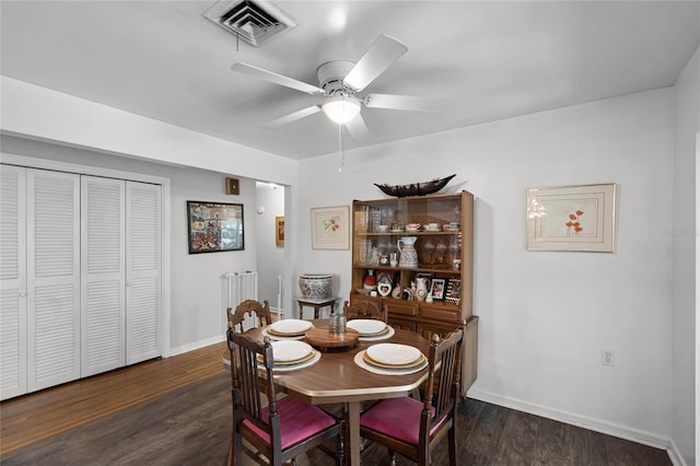 dining area featuring ceiling fan, visible vents, baseboards, and wood finished floors