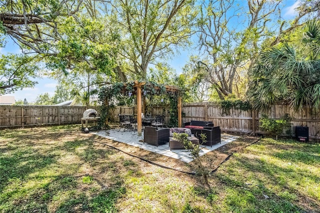 view of yard featuring outdoor lounge area, a patio area, and a fenced backyard