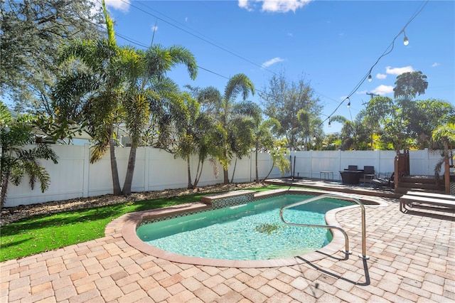 view of pool with a fenced backyard, a fenced in pool, and a patio