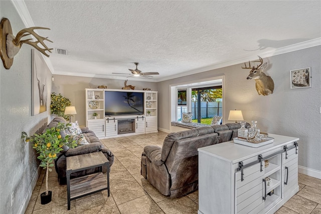 living room featuring a textured ceiling, ornamental molding, and a textured wall