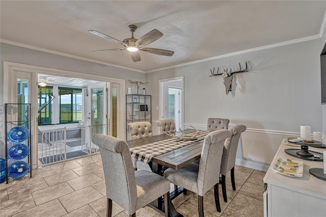 dining area featuring crown molding and ceiling fan